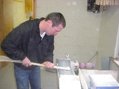 Francis sanding a hurley